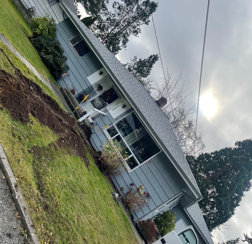 Asphalt shingle roof being installed