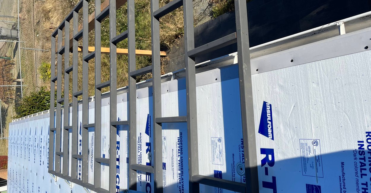 Asphalt shingle roof being installed