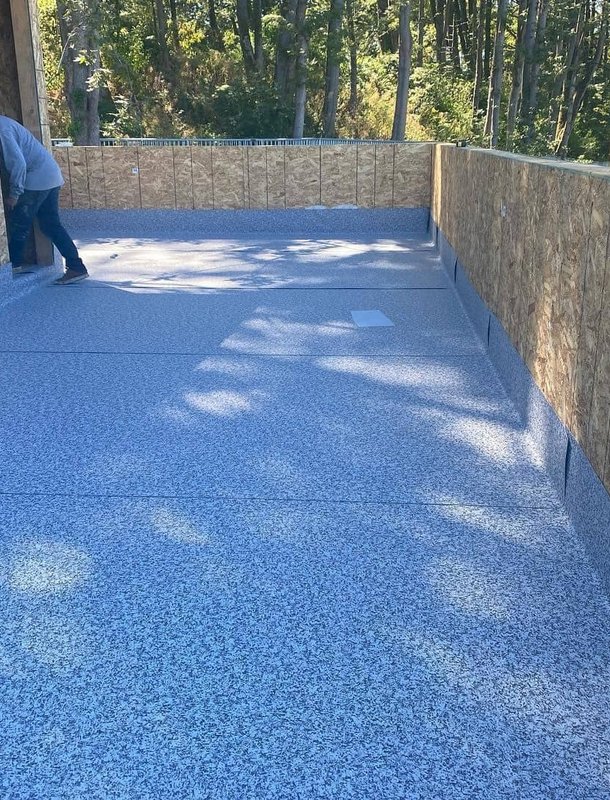 Rolled roofing membrane installation on home