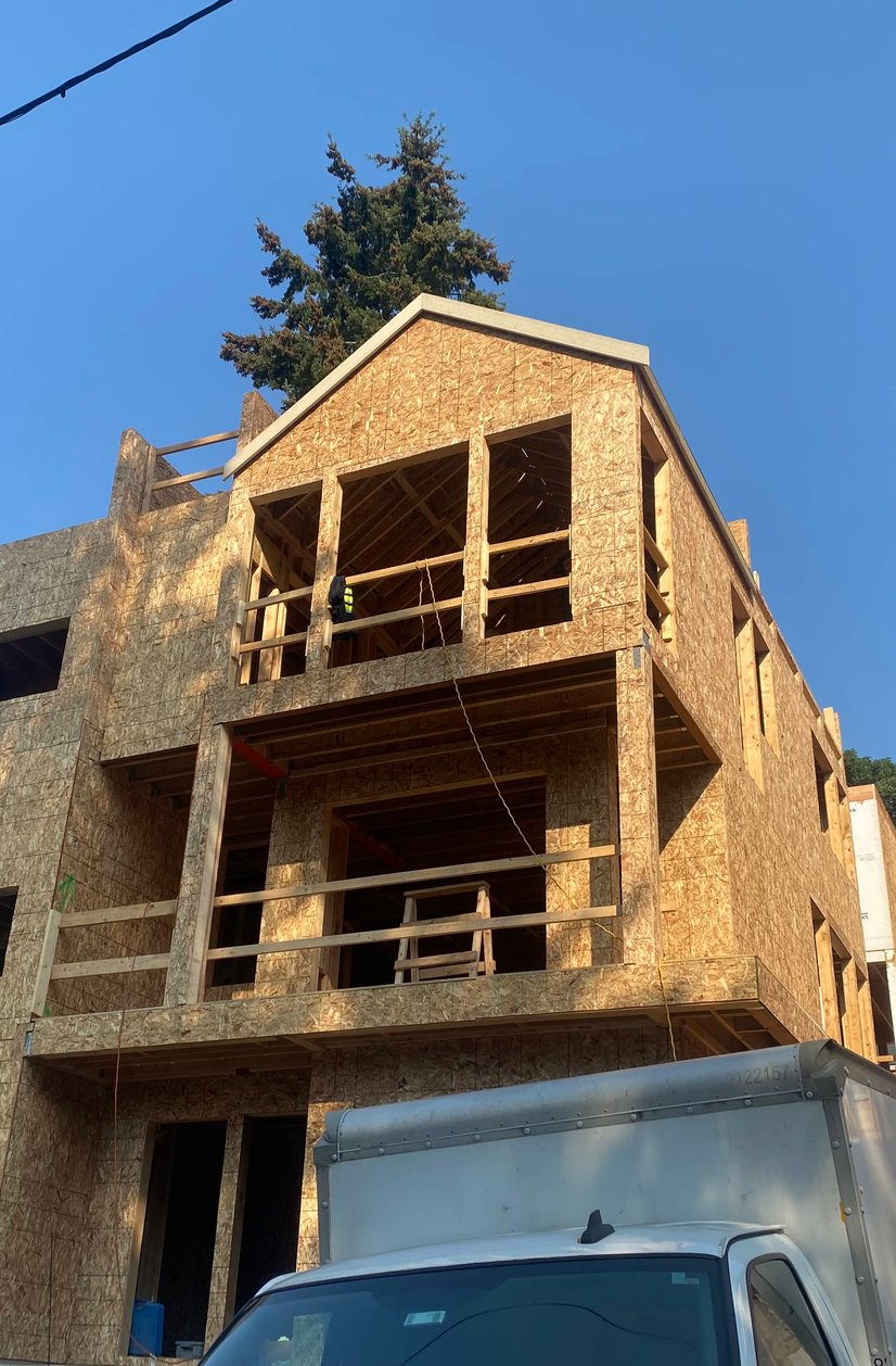 New construction home with full roof installation